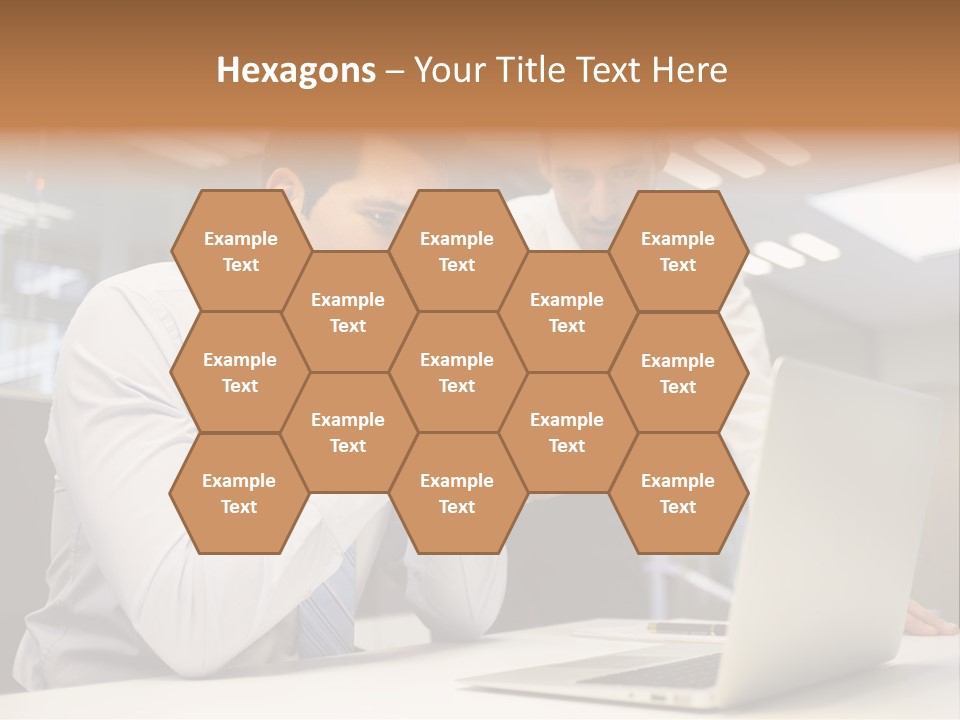 Two Men Sitting At A Table Looking At A Laptop PowerPoint Template