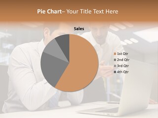 Two Men Sitting At A Table Looking At A Laptop PowerPoint Template