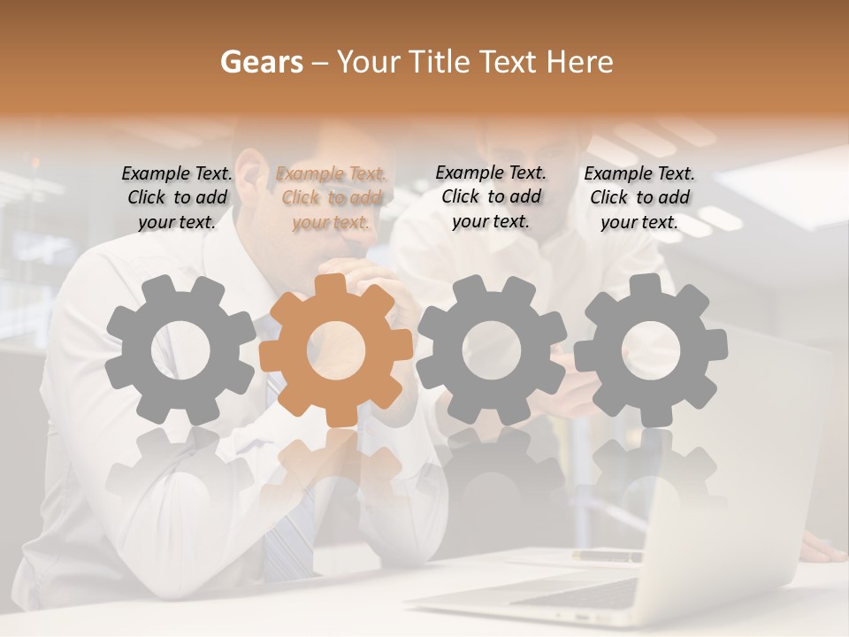 Two Men Sitting At A Table Looking At A Laptop PowerPoint Template