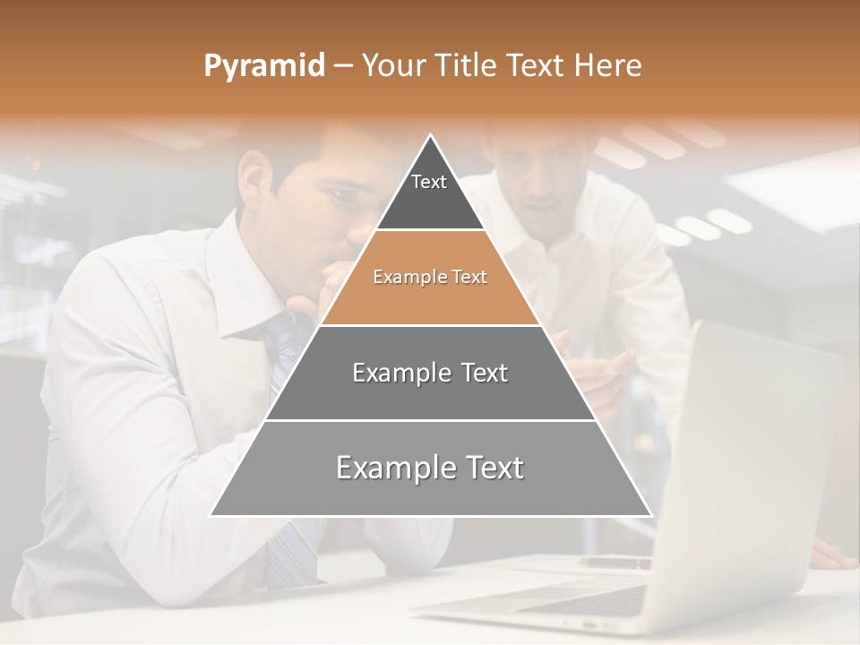 Two Men Sitting At A Table Looking At A Laptop PowerPoint Template