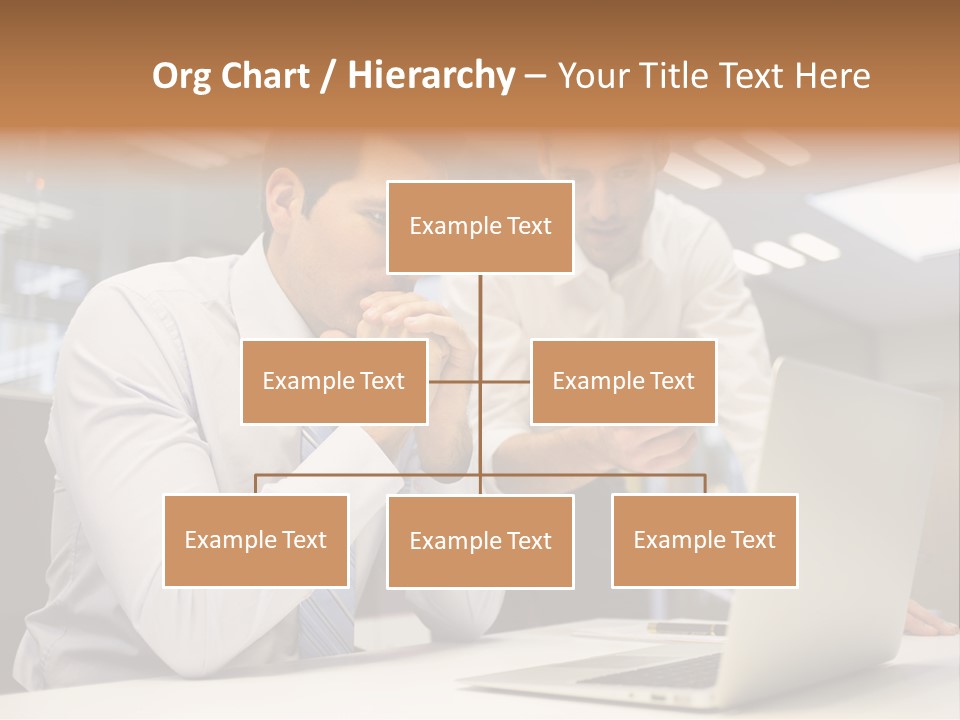 Two Men Sitting At A Table Looking At A Laptop PowerPoint Template