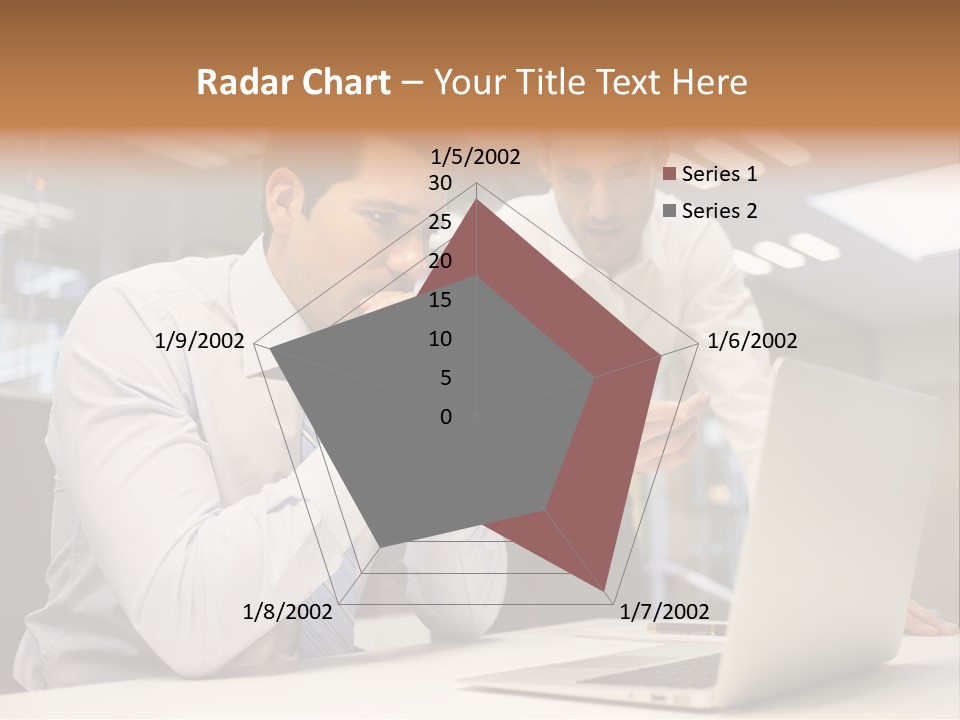 Two Men Sitting At A Table Looking At A Laptop PowerPoint Template