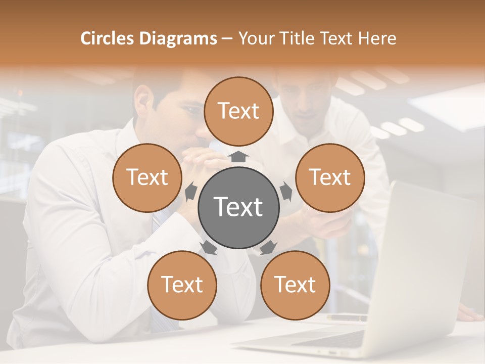 Two Men Sitting At A Table Looking At A Laptop PowerPoint Template