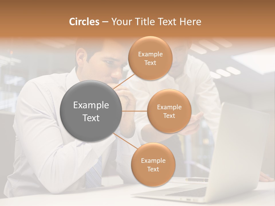Two Men Sitting At A Table Looking At A Laptop PowerPoint Template