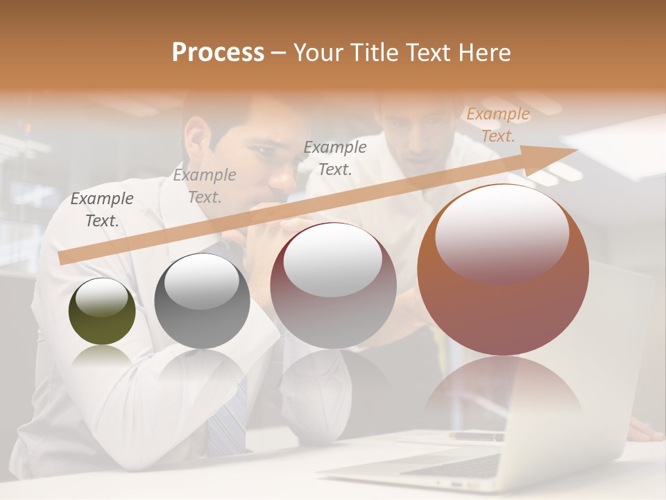 Two Men Sitting At A Table Looking At A Laptop PowerPoint Template