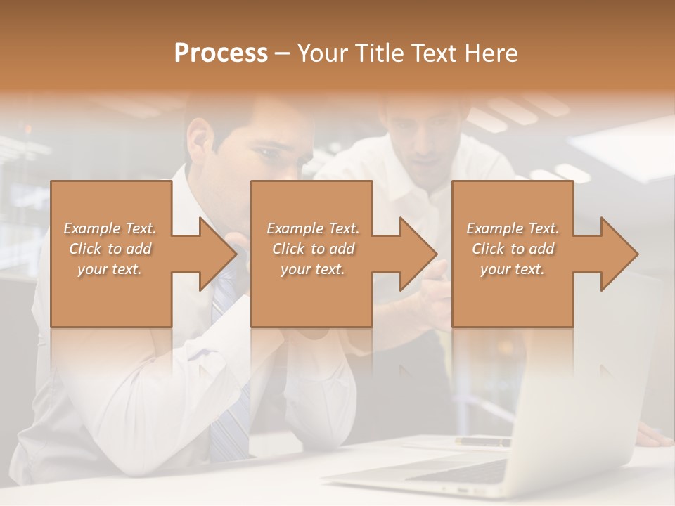 Two Men Sitting At A Table Looking At A Laptop PowerPoint Template