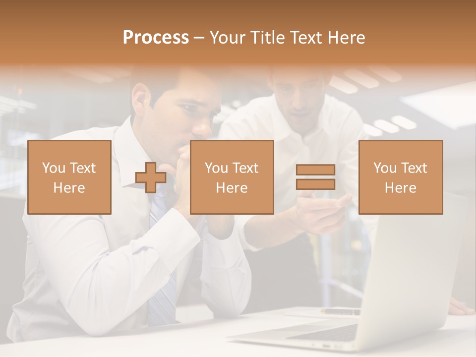 Two Men Sitting At A Table Looking At A Laptop PowerPoint Template