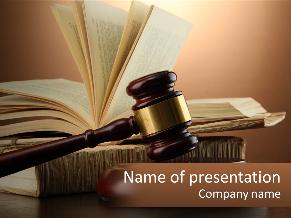 A Judge's Gaven Sitting On Top Of A Book PowerPoint Template