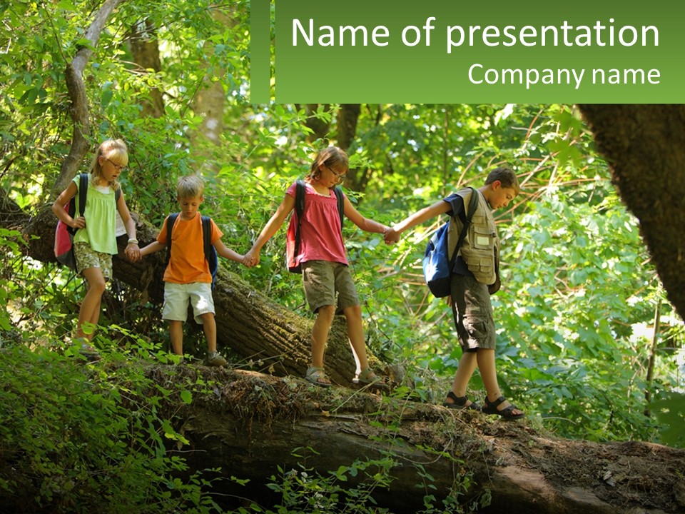A Group Of Kids Walking On A Log In The Woods PowerPoint Template