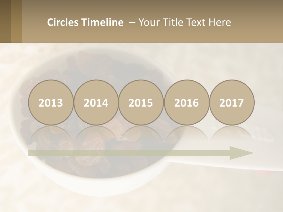 A White Spoon Filled With Raisins On Top Of A Table PowerPoint Template