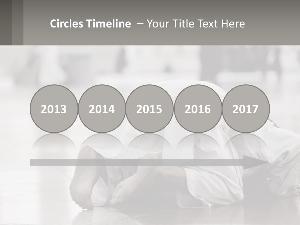 A Man Laying On The Ground With His Head In His Hands PowerPoint Template