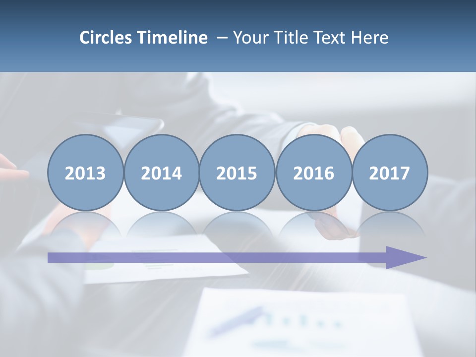 Two Business People Shaking Hands Over A Table PowerPoint Template