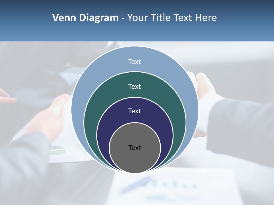 Two Business People Shaking Hands Over A Table PowerPoint Template