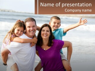 A Family Posing For A Picture On The Beach PowerPoint Template