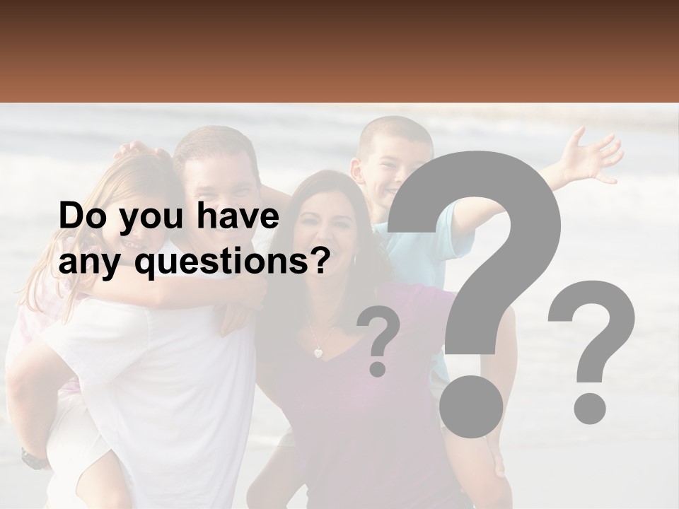 A Family Posing For A Picture On The Beach PowerPoint Template