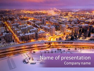 An Aerial View Of A City At Night PowerPoint Template