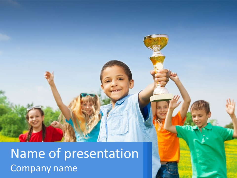 A Group Of Children Holding Up A Trophy PowerPoint Template