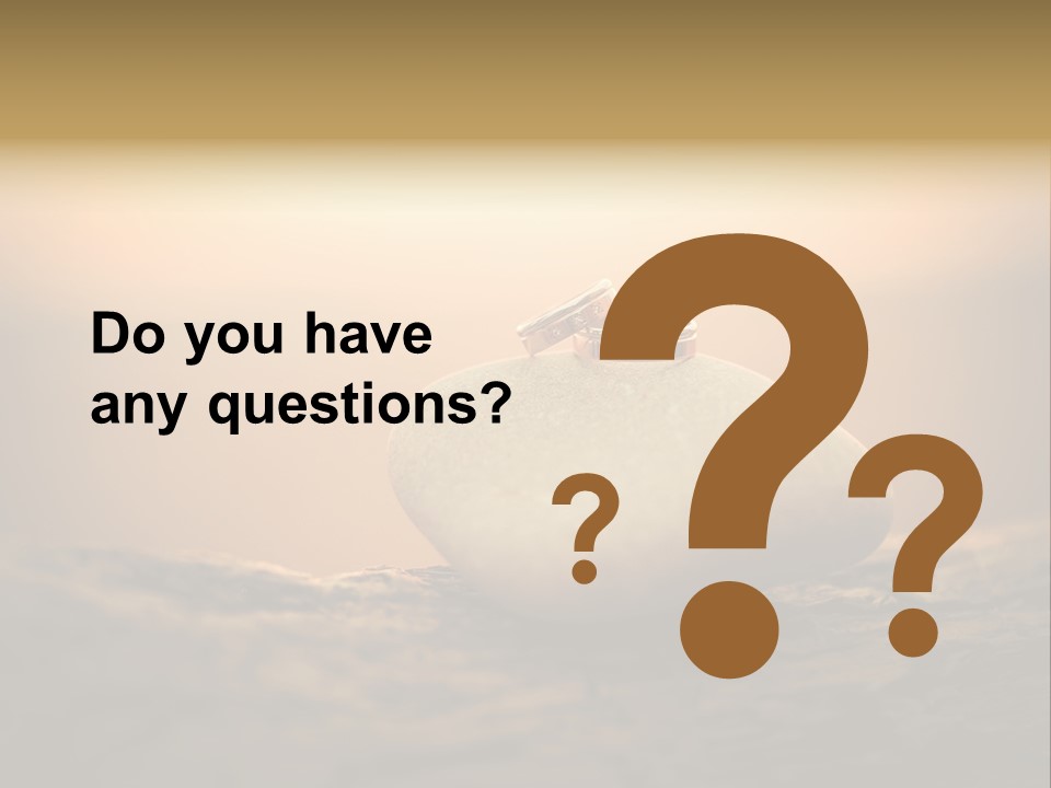 Two Wedding Rings Sitting On Top Of A Rock PowerPoint Template