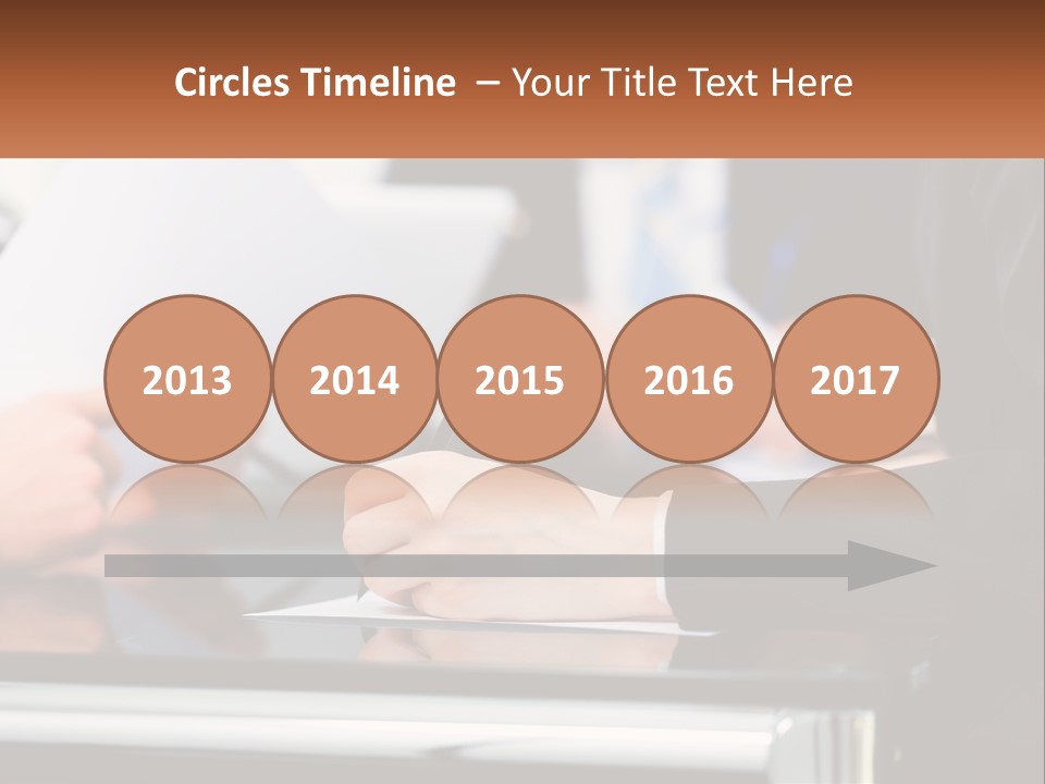 A Group Of People Writing On A Piece Of Paper PowerPoint Template