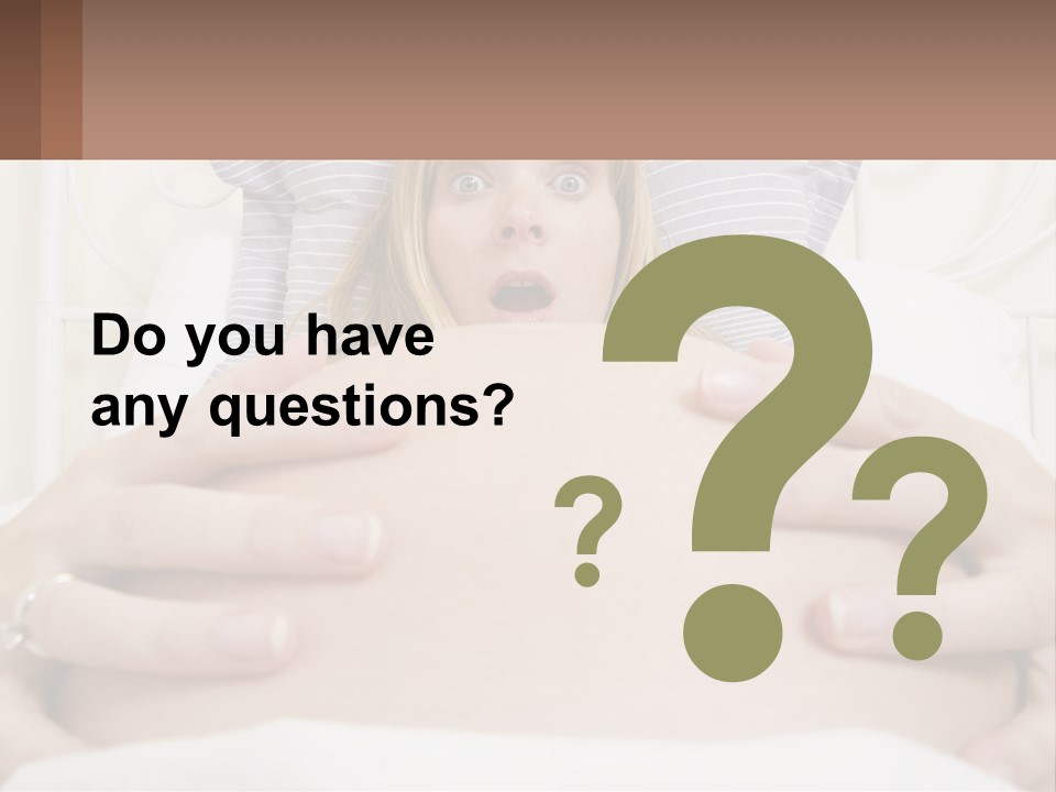 A Pregnant Woman Laying In Bed With Her Hands On Her Belly PowerPoint Template