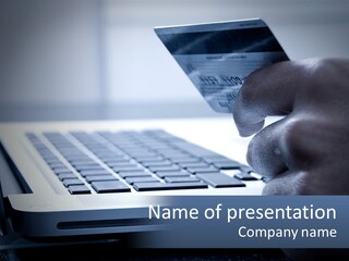 A Person Holding A Credit Card In Front Of A Laptop PowerPoint Template