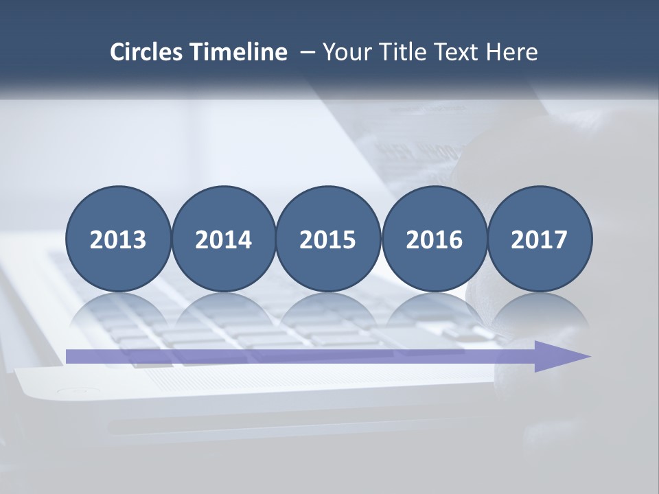 A Person Holding A Credit Card In Front Of A Laptop PowerPoint Template