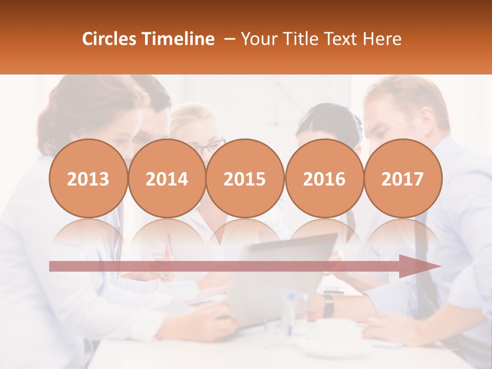 A Group Of Business People Looking At A Laptop PowerPoint Template