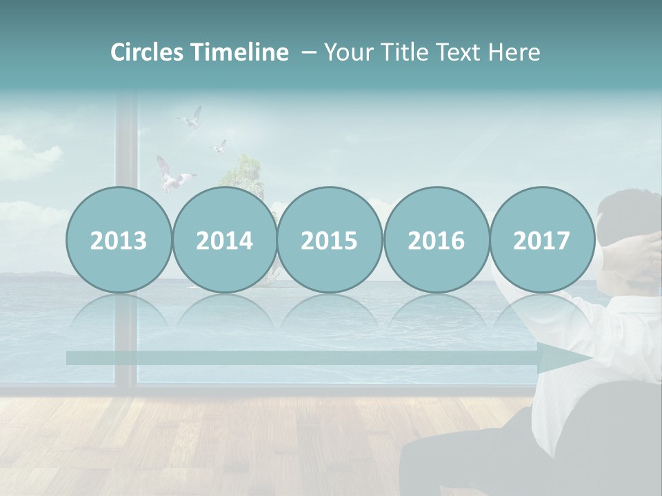 A Man Sitting On A Chair Looking Out At The Ocean PowerPoint Template