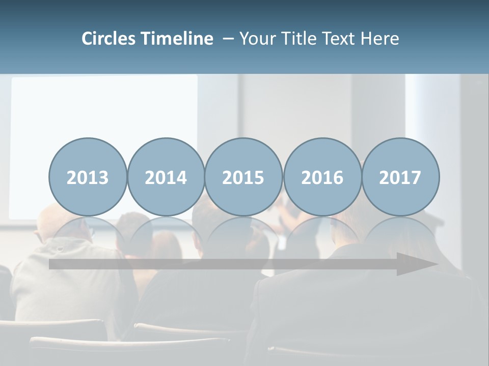 A Woman Giving A Presentation To A Group Of People PowerPoint Template