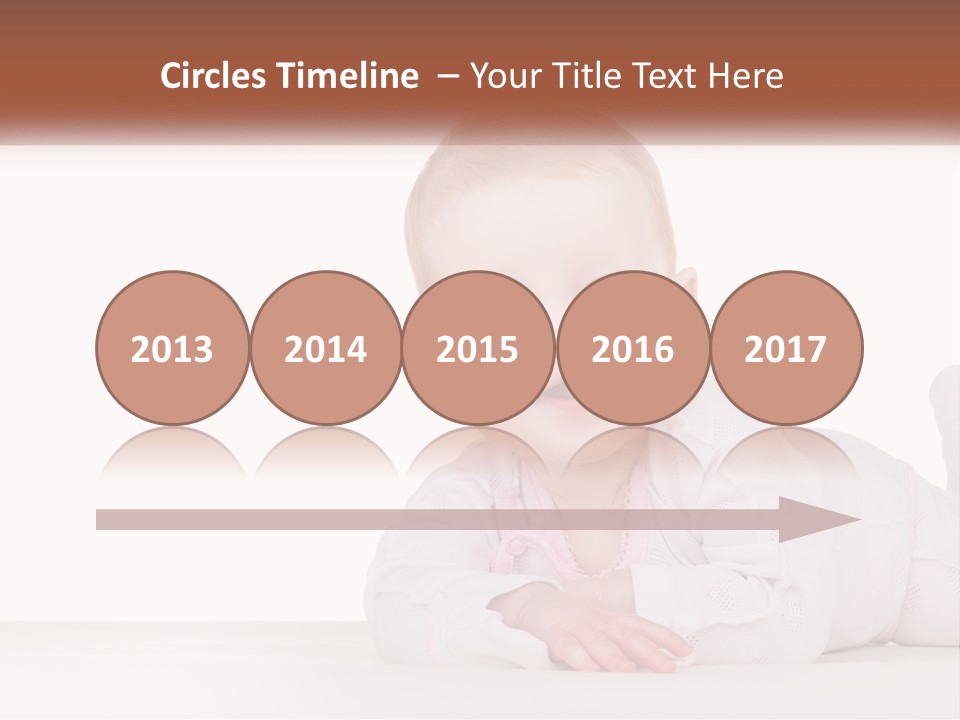 A Baby Is Laying Down On The Floor PowerPoint Template