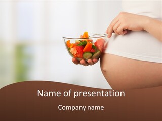 A Pregnant Woman Holding A Bowl Of Vegetables PowerPoint Template