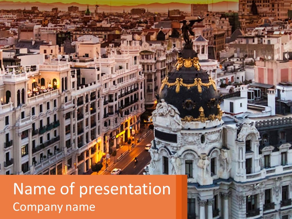 An Aerial View Of A City At Sunset PowerPoint Template