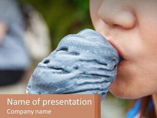 A Child Is Eating A Piece Of Blue Ice Cream PowerPoint Template
