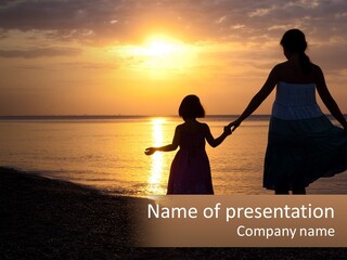 A Mother And Daughter Holding Hands On The Beach At Sunset PowerPoint Template