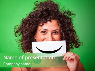 A Woman Holding A Card With A Smiley Face On It PowerPoint Template