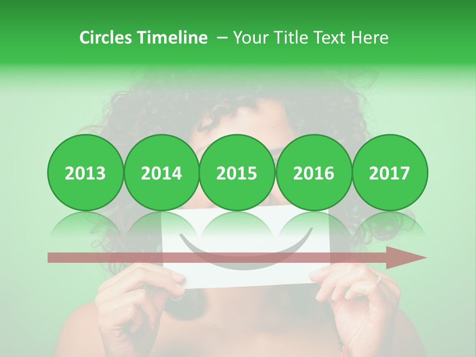 A Woman Holding A Card With A Smiley Face On It PowerPoint Template