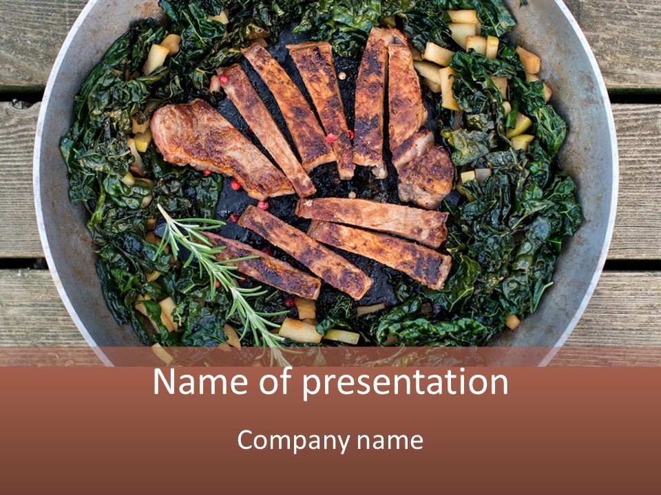 A Pan Filled With Meat And Greens On Top Of A Wooden Table PowerPoint Template