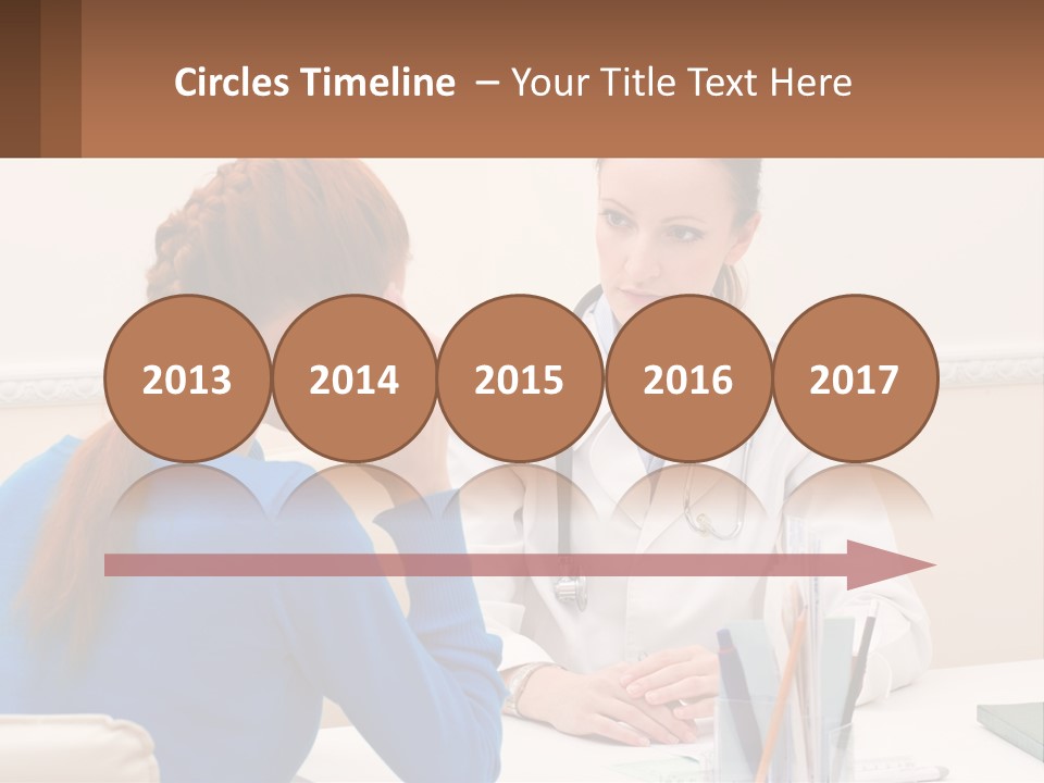 A Doctor Talking To A Patient At A Desk PowerPoint Template