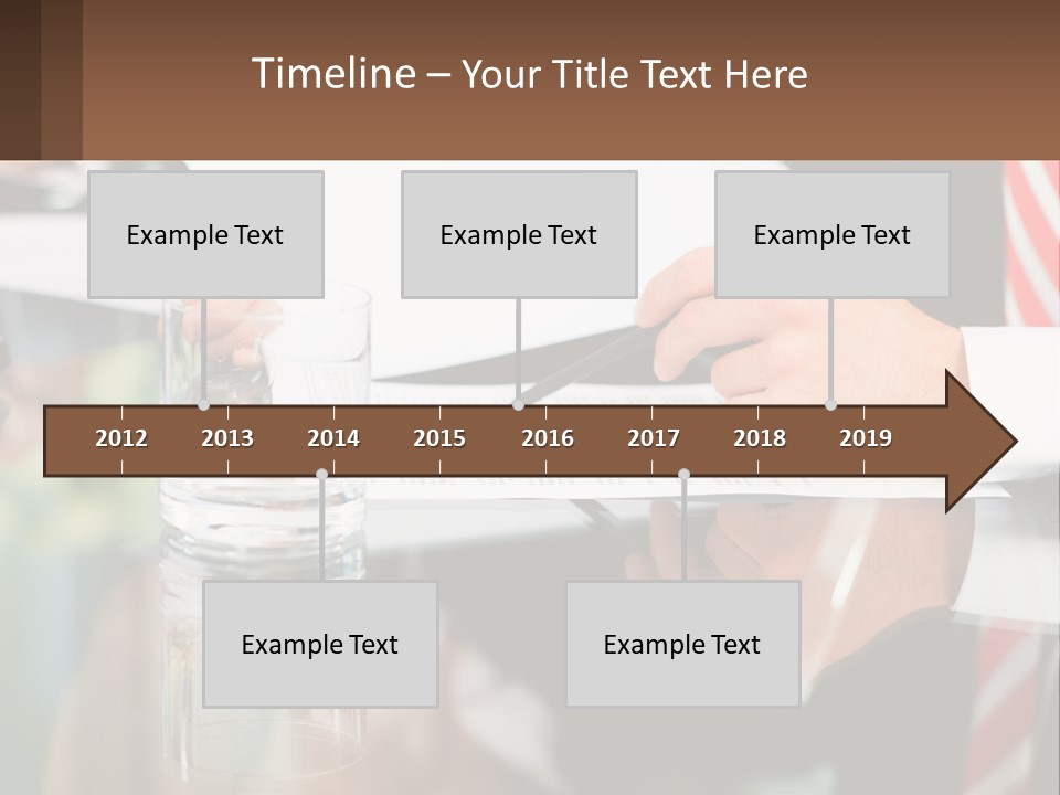 A Man In A Suit Writing On A Piece Of Paper PowerPoint Template
