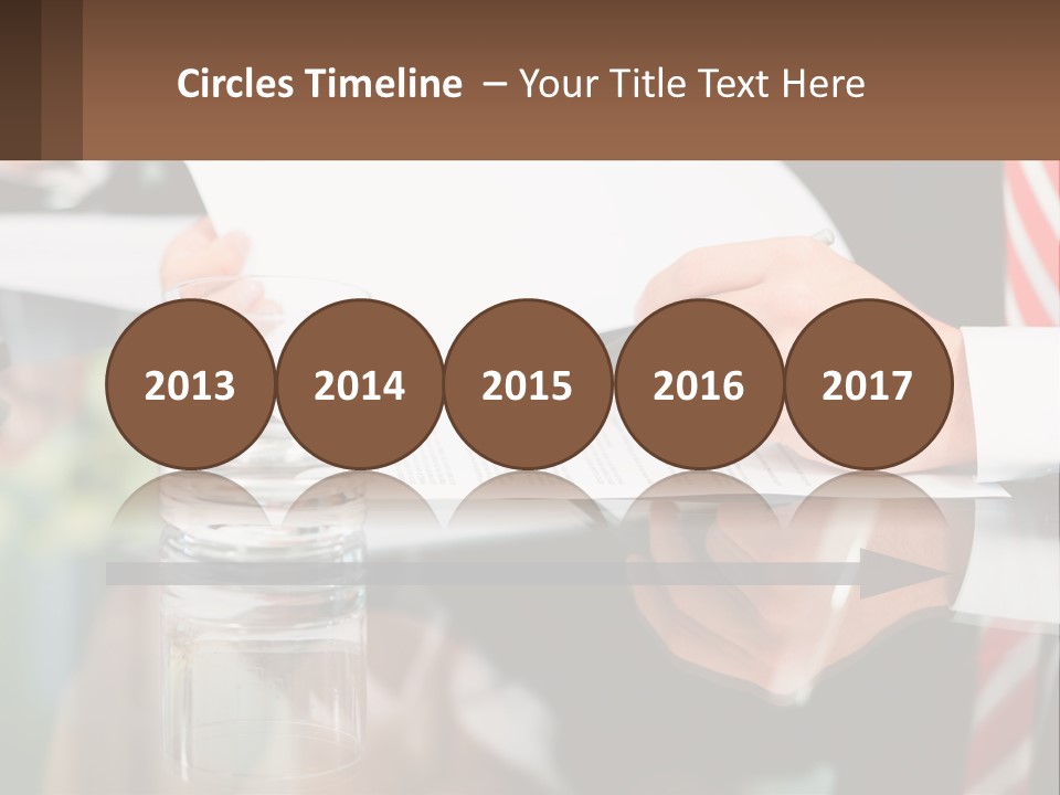 A Man In A Suit Writing On A Piece Of Paper PowerPoint Template