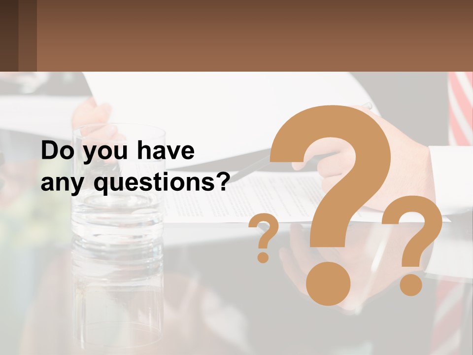 A Man In A Suit Writing On A Piece Of Paper PowerPoint Template