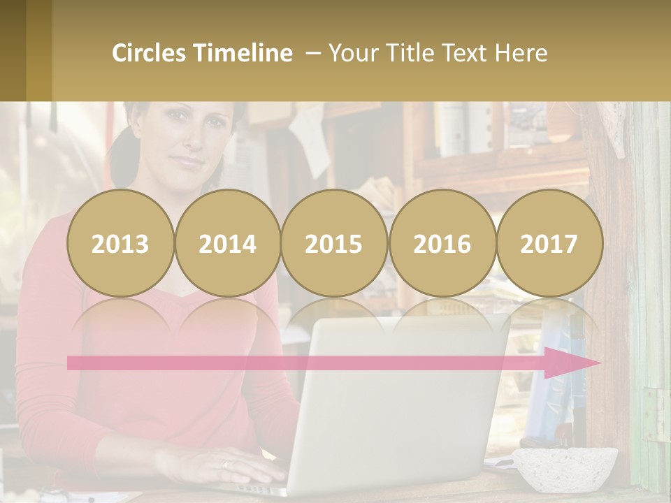 A Woman Sitting In Front Of A Laptop Computer PowerPoint Template