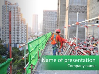 A Construction Worker On Top Of A Building PowerPoint Template