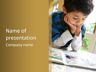 A Young Boy Reading A Book On Top Of A Table PowerPoint Template