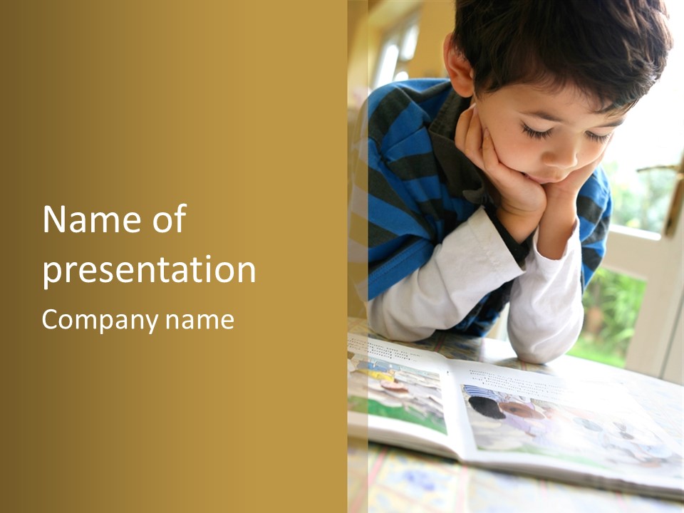 A Young Boy Reading A Book On Top Of A Table PowerPoint Template