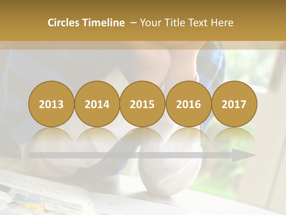 A Young Boy Reading A Book On Top Of A Table PowerPoint Template