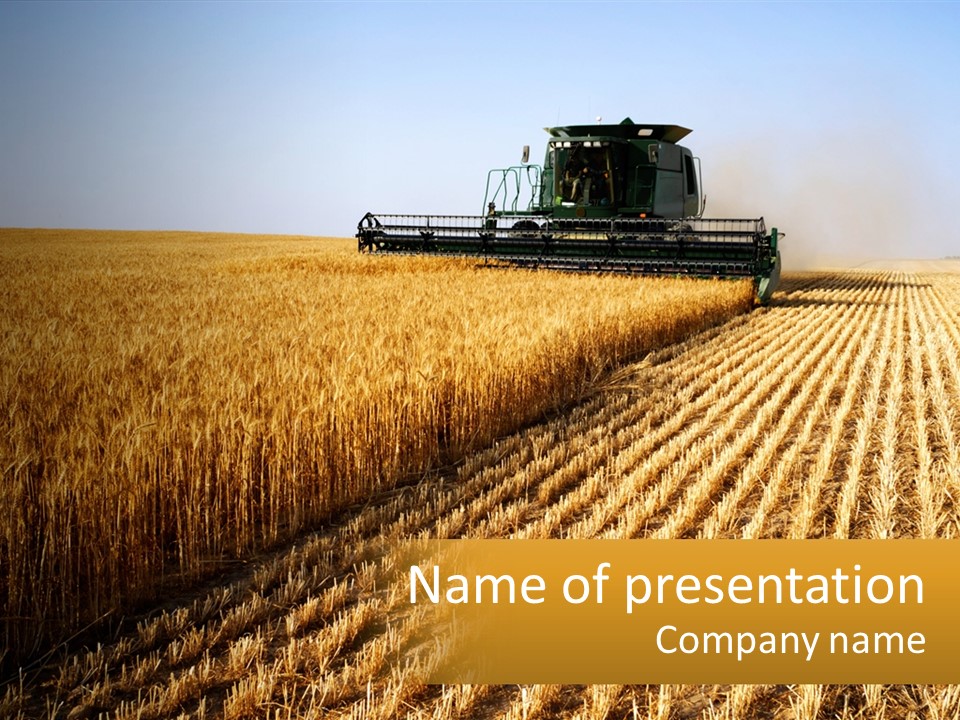 A Farm Field With A Combiner In The Middle Of It PowerPoint Template