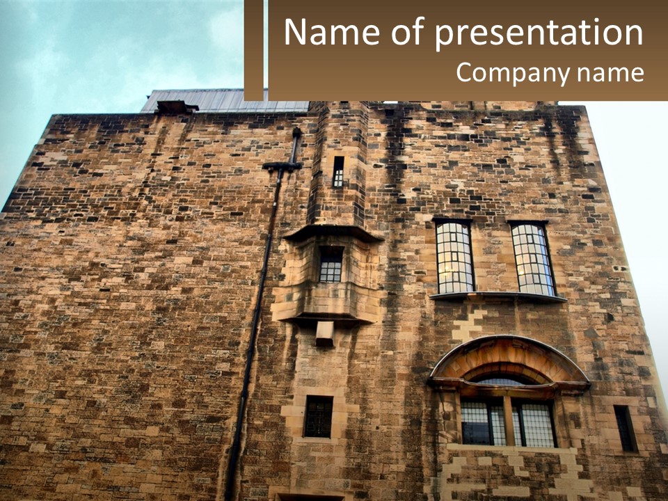 A Tall Brick Building With Windows And A Sky Background PowerPoint Template