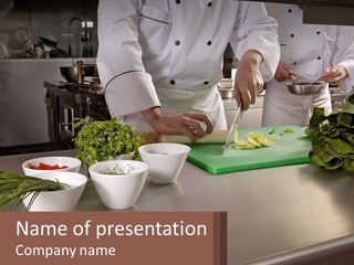 A Group Of Chefs Preparing Food In A Kitchen PowerPoint Template