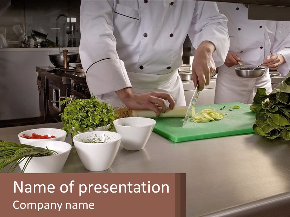 A Group Of Chefs Preparing Food In A Kitchen PowerPoint Template